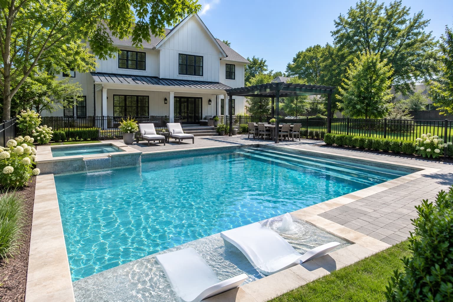 AI concept image: a rectangular pool in front of a white two-story house, with a sun shelf, a raised spa, a pergola and an iron fence